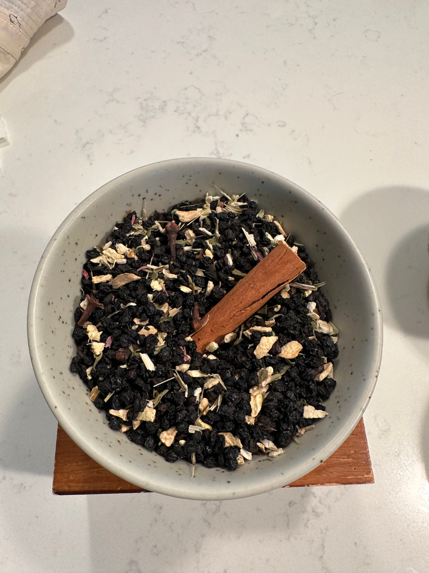 Apple + Cinnamon botanical tea blend in a ceramic bowl